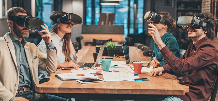 Small group of people using virtual reality headsets