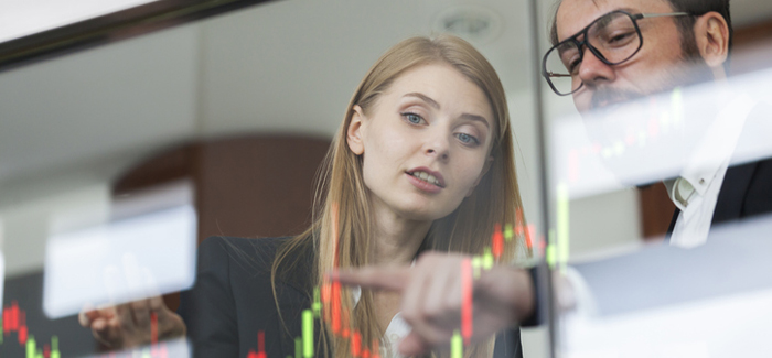 Man and woman analyse data